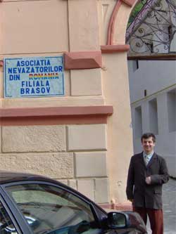President Virgil Lazar in front of the branch's head office
